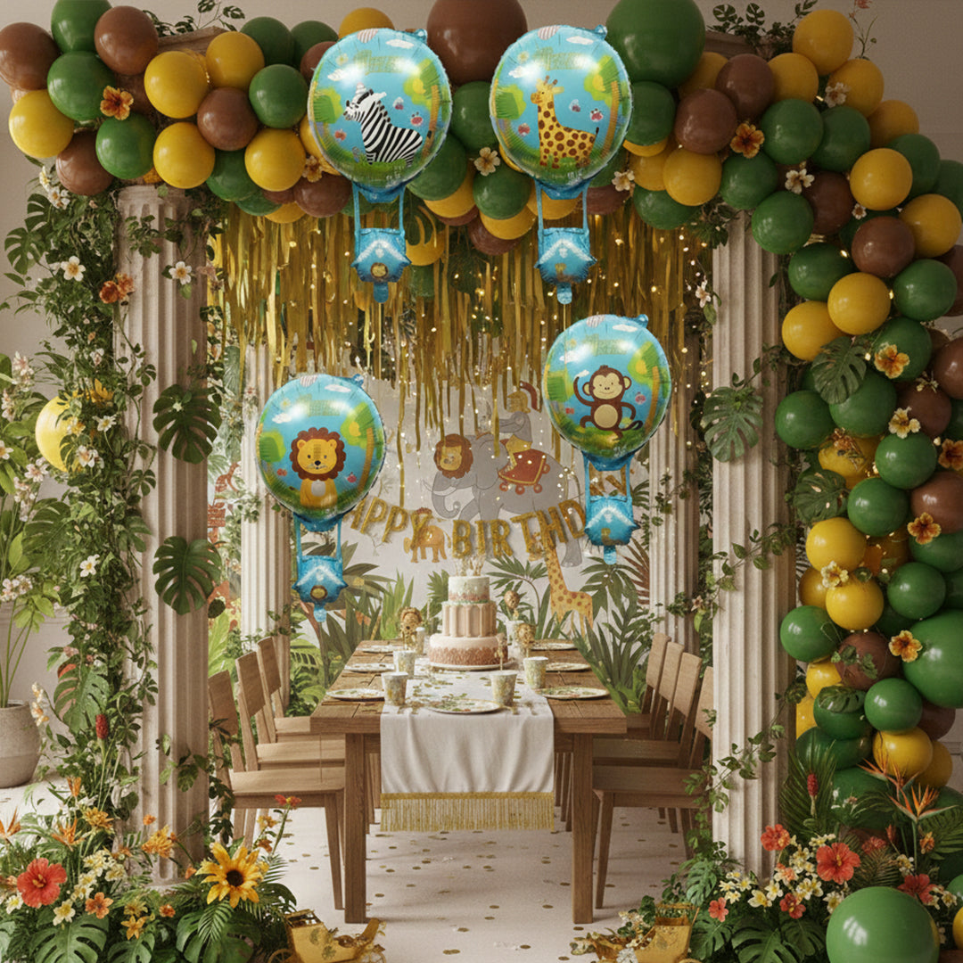 Jungle safari theme birthday decoration with animal balloons and tropical leaves