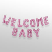 Welcome baby pink foil balloon banner with white polka dots
