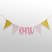 Pink and golden 1st birthday bunting banner with ONE text
